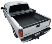 Place the tonneau cover on the bed rails and clamp.