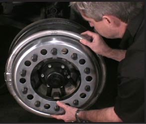 Installing Centramatic wheel balancers on a front wheel
