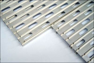 Modular deck panels slide together to form a solid deck plate system for truck frame rails